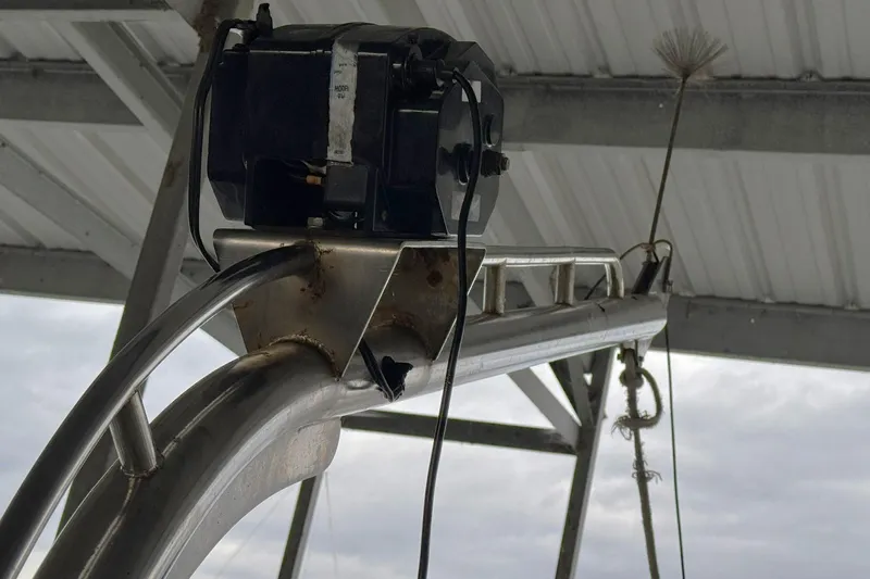 Sandial Yacht Photos Pics Close-up of a 1991 DeFever 44 boat's metal structure under a roof.