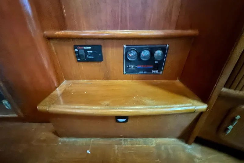 Sandial Yacht Photos Pics Control panel on 1991 DeFever 44 yacht, featuring gauges and wooden interior.