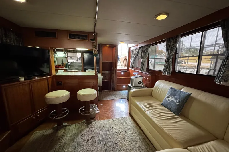 Sandial Yacht Photos Pics Interior of 1991 DeFever 44 yacht with cozy seating and modern amenities.