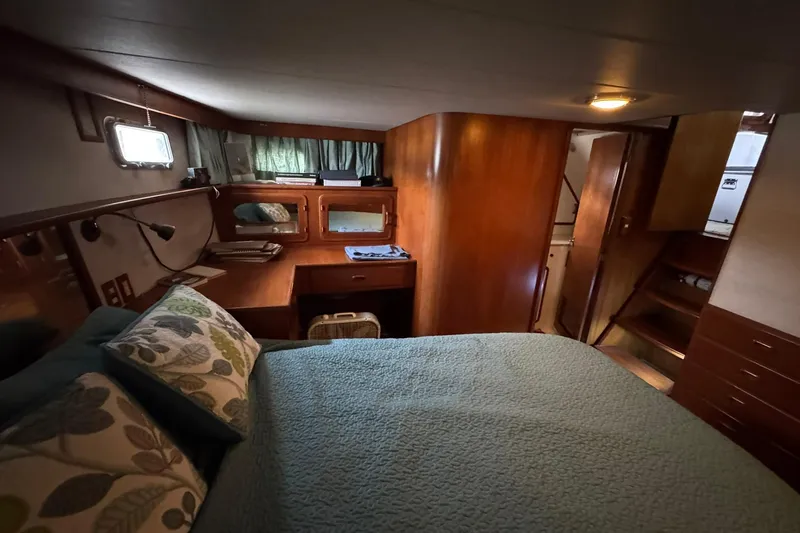Sandial Yacht Photos Pics Cozy cabin interior of 1991 DeFever 44 yacht with bed and wooden furnishings.