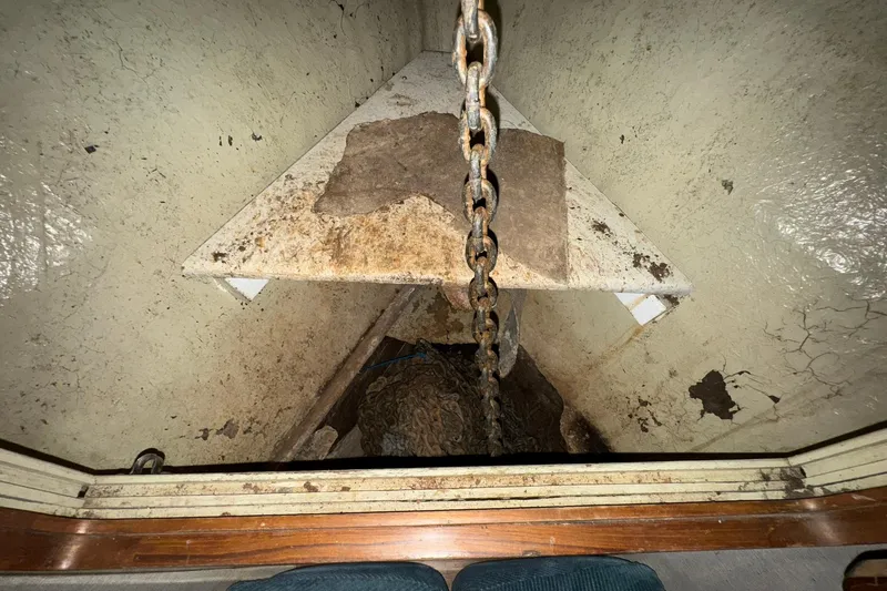 Sandial Yacht Photos Pics Anchor chain compartment of 1991 DeFever 44 boat, showing rust and wear.