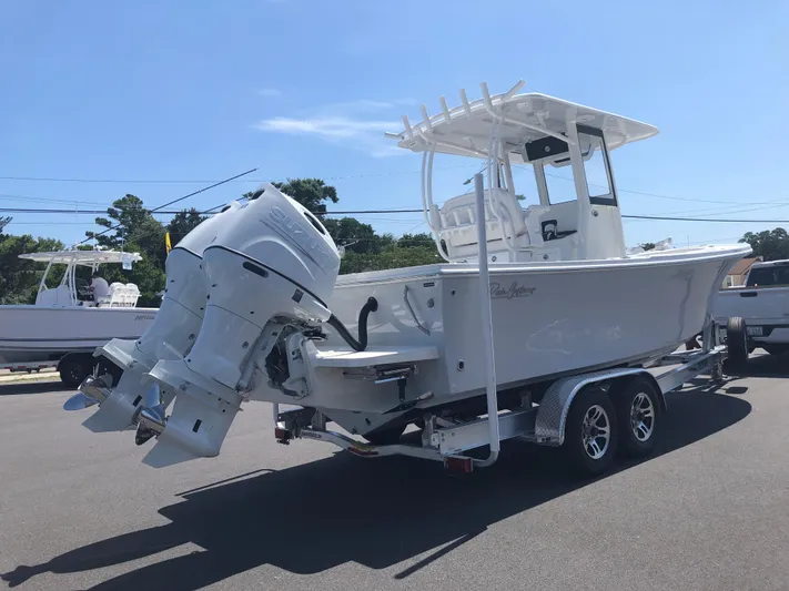  Yacht Photos Pics 2026 Pair Customs 24 Center Console DV boat on trailer, featuring dual outboard engines.