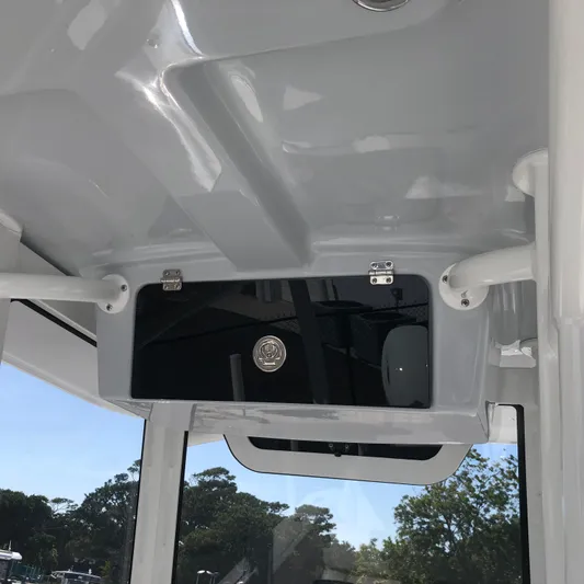  Yacht Photos Pics Interior view of 2026 Pair Customs 24 Center Console DV boat, featuring sleek design and storage compartment.