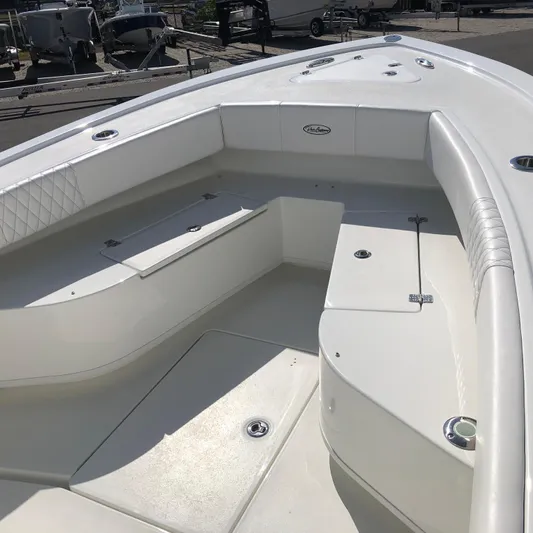  Yacht Photos Pics 2026 Pair Customs 24 Center Console DV boat interior with white seating and storage compartments.