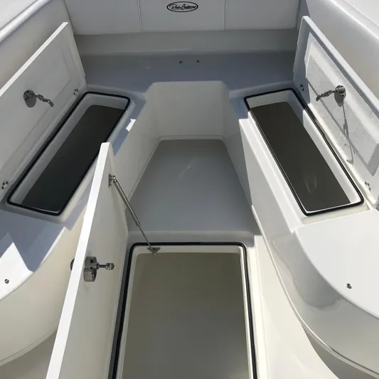  Yacht Photos Pics 2026 Pair Customs 24 Center Console DV boat interior with open storage compartments.