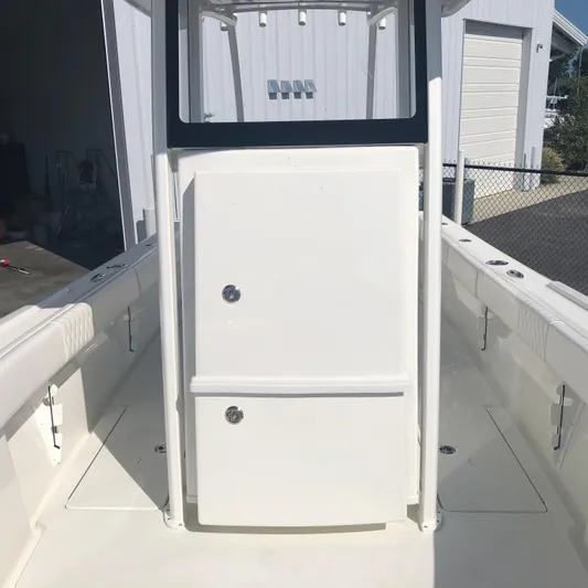  Yacht Photos Pics 2026 Pair Customs 24 Center Console DV boat interior, featuring sleek white design and spacious layout.