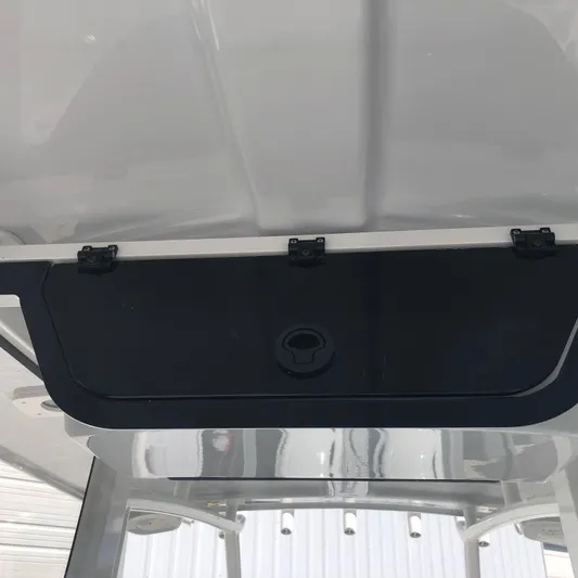  Yacht Photos Pics 2026 Pair Customs 24 Center Console DV boat interior storage compartment.