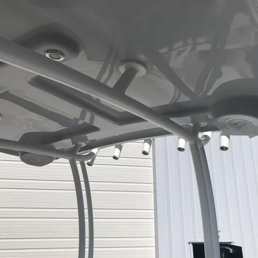  Yacht Photos Pics 2026 Pair Customs 24 Center Console DV boat roof with rod holders and sleek design.