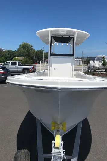  Yacht Photos Pics 2026 Pair Customs 24 Center Console DV boat on trailer in parking lot.