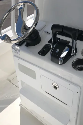  Yacht Photos Pics 2026 Pair Customs 24 Center Console DV helm with steering wheel and controls.