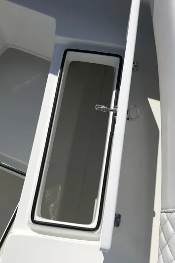 Yacht Photos Pics 2026 Pair Customs 24 Center Console DV boat storage compartment, open lid, white interior.