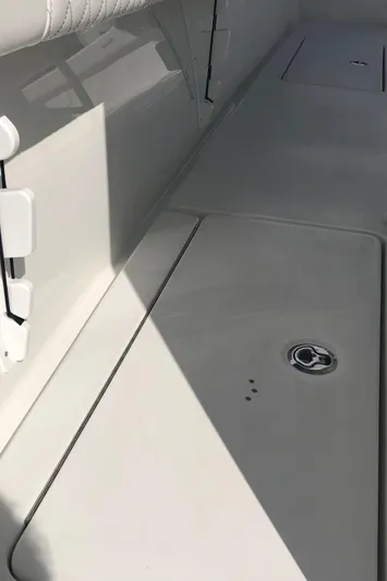  Yacht Photos Pics 2026 Pair Customs 24 Center Console DV boat interior, featuring sleek white deck design.
