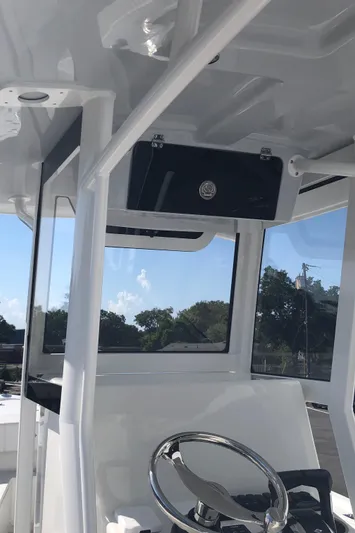  Yacht Photos Pics 2026 Pair Customs 24 Center Console DV boat interior with steering wheel and console.