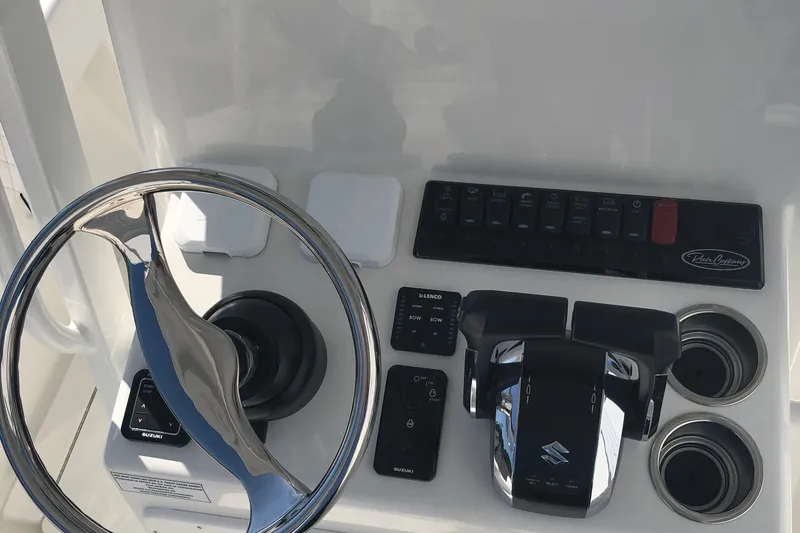  Yacht Photos Pics Steering console of 2026 Pair Customs 24 Center Console DV boat with controls and switches.
