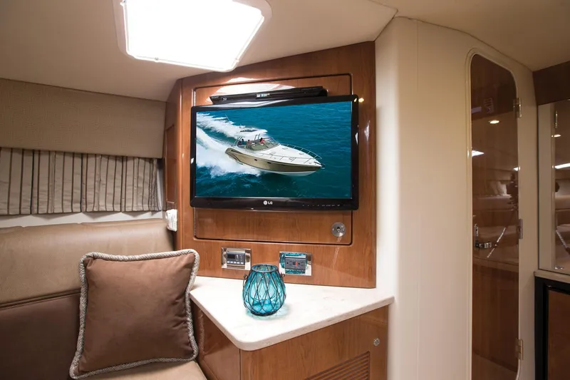 Wet Benefits Yacht Photos Pics Manufacturer Provided Image: Interior of 2015 Formula 370 Super Sport yacht with TV and cozy seating area.