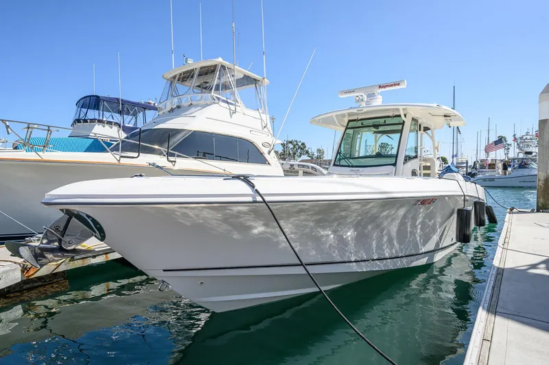 Nothing But Net Yacht Photos Pics 2016 Boston Whaler 350 Outrage docked at marina.