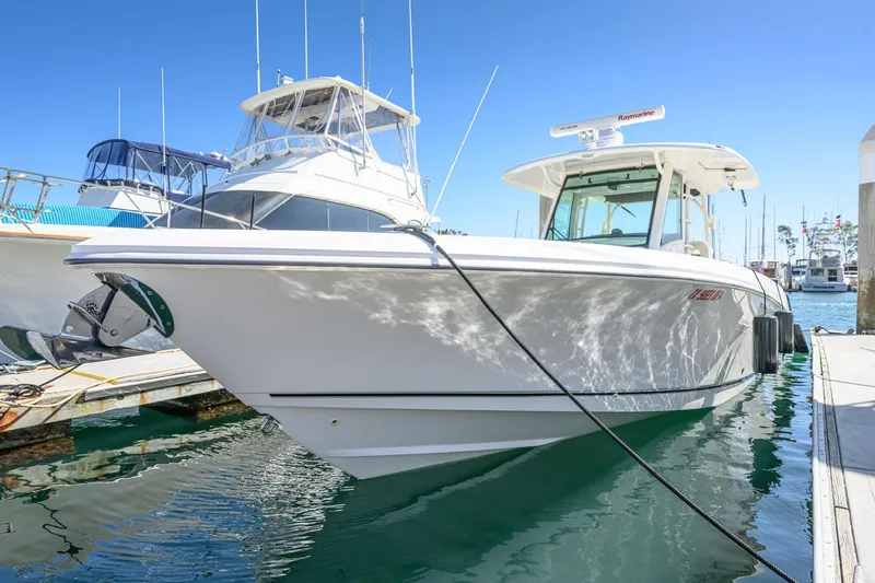 Nothing But Net Yacht Photos Pics 2016 Boston Whaler 350 Outrage docked at marina.