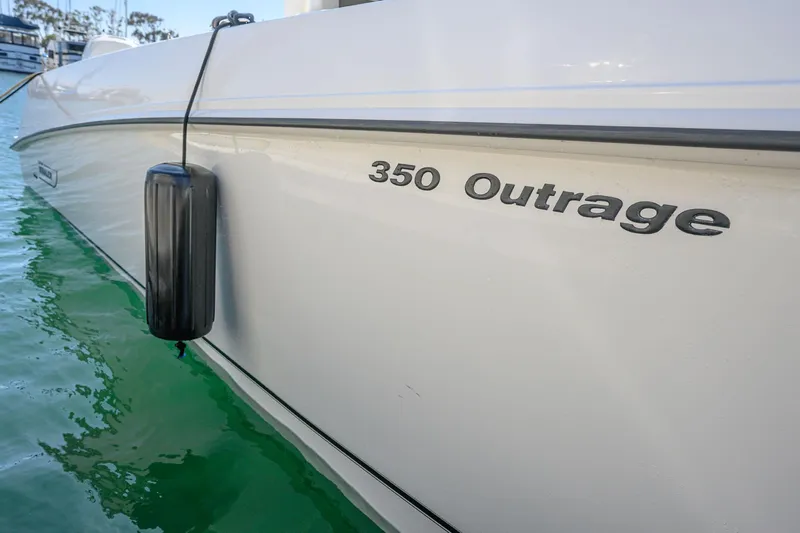 Nothing But Net Yacht Photos Pics Boston Whaler 350 Outrage 2016 boat on water, side view.