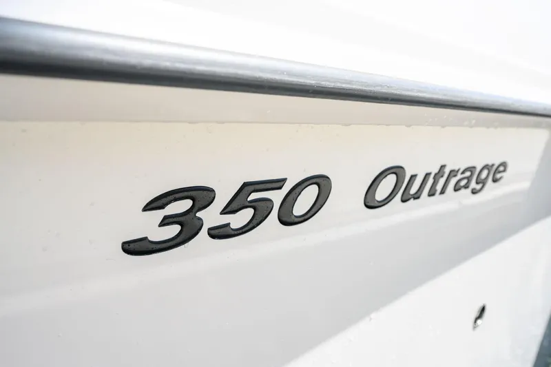 Nothing But Net Yacht Photos Pics Boston Whaler 350 Outrage 2016 emblem on boat hull.