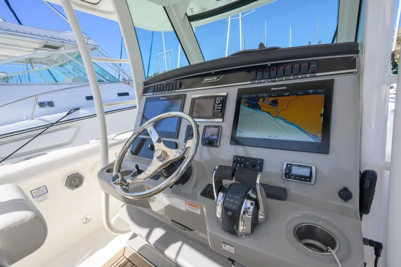 Nothing But Net Yacht Photos Pics 2016 Boston Whaler 350 Outrage helm with navigation system.
