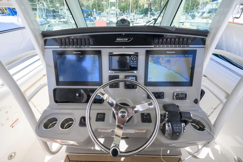 Nothing But Net Yacht Photos Pics 2016 Boston Whaler 350 Outrage helm with navigation systems.
