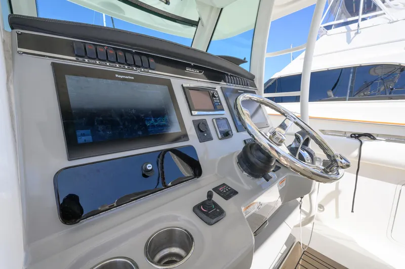 Nothing But Net Yacht Photos Pics 2016 Boston Whaler 350 Outrage helm with electronics.