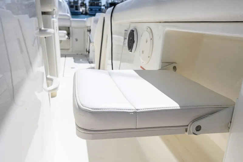 Nothing But Net Yacht Photos Pics Folding seat on Boston Whaler 350 Outrage, 2016 model.