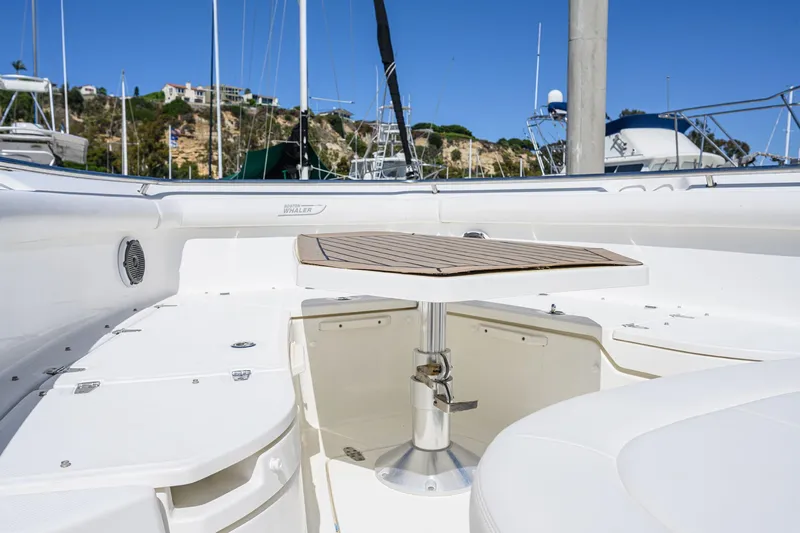 Nothing But Net Yacht Photos Pics 2016 Boston Whaler 350 Outrage with deck table in harbor.