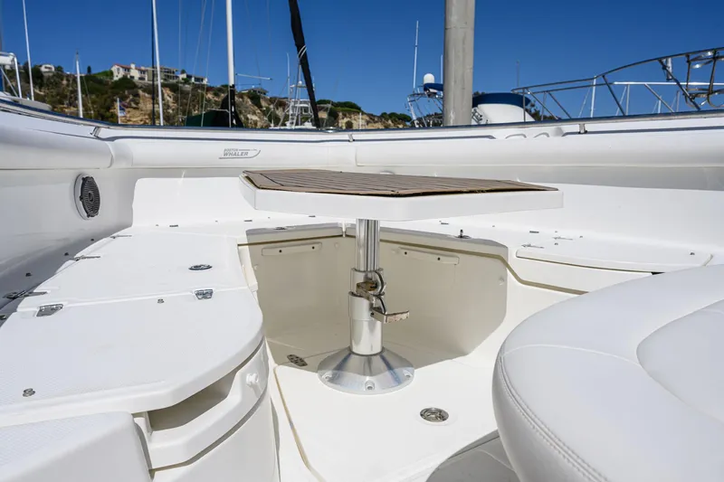 Nothing But Net Yacht Photos Pics Interior of a 2016 Boston Whaler 350 Outrage boat with table.