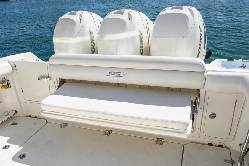Nothing But Net Yacht Photos Pics 2016 Boston Whaler 350 Outrage with three Mercury engines by the water.