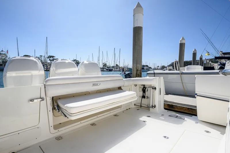 Nothing But Net Yacht Photos Pics 2016 Boston Whaler 350 Outrage at dock, empty seating area visible.