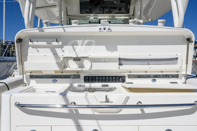 Nothing But Net Yacht Photos Pics Boston Whaler 350 Outrage 2016, helm console with storage and controls.