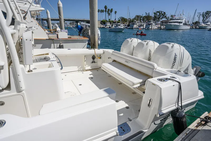 Nothing But Net Yacht Photos Pics 2016 Boston Whaler 350 Outrage docked, featuring triple outboard engines.