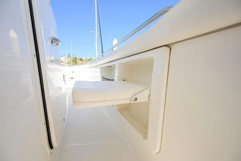 Nothing But Net Yacht Photos Pics Foldable seat on a 2016 Boston Whaler 350 Outrage.