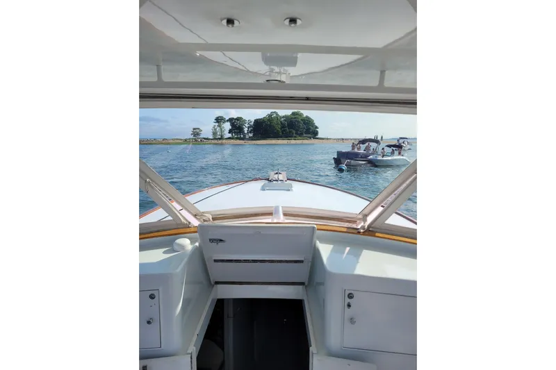  Yacht Photos Pics View from 1984 Sunny Briggs 37 Express boat, overlooking water and nearby island.