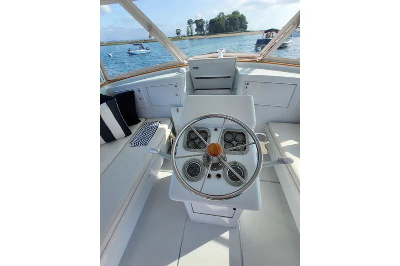  Yacht Photos Pics Helm of 1984 Sunny Briggs 37 Express boat with scenic water view.