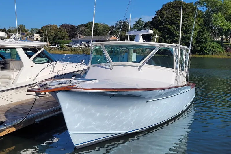  Yacht Photos Pics 1984 Sunny Briggs 37 Express boat docked on a sunny day.