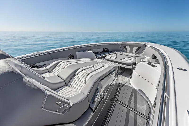  Yacht Photos Pics Luxurious 2024 MTI V42 boat interior with sleek seating and ocean view.
