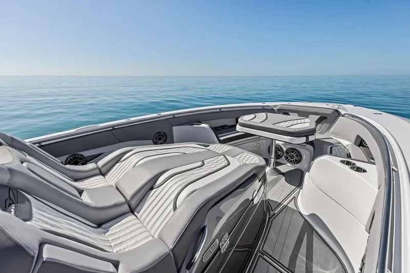  Yacht Photos Pics Luxurious 2024 MTI V42 boat interior with sleek seating and ocean view.