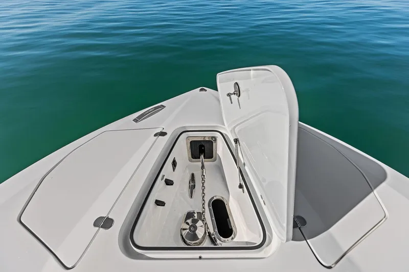 Yacht Photos Pics Open anchor compartment on 2024 MTI V42 boat, floating on calm blue water.