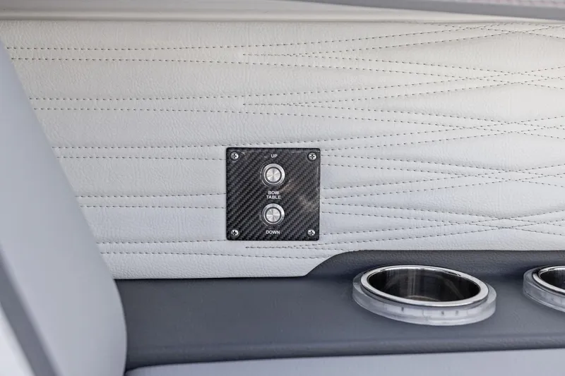  Yacht Photos Pics 2024 MTI V42 interior with carbon fiber panel and cup holders.