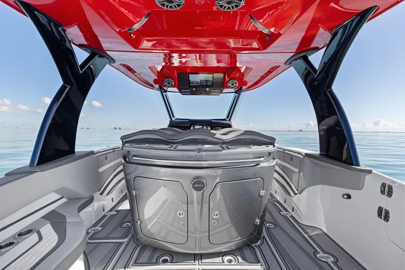  Yacht Photos Pics 2024 MTI V42 boat interior with sleek design and vibrant red canopy.