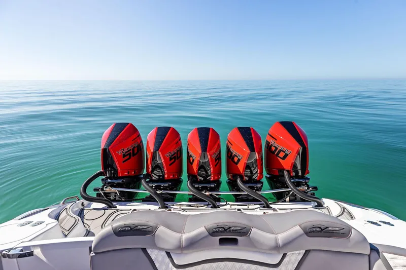  Yacht Photos Pics 2024 MTI V42 boat with five powerful outboard engines on calm sea.