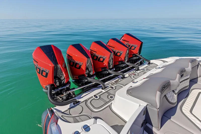  Yacht Photos Pics 2024 MTI V42 boat with four powerful red outboard engines on calm water.