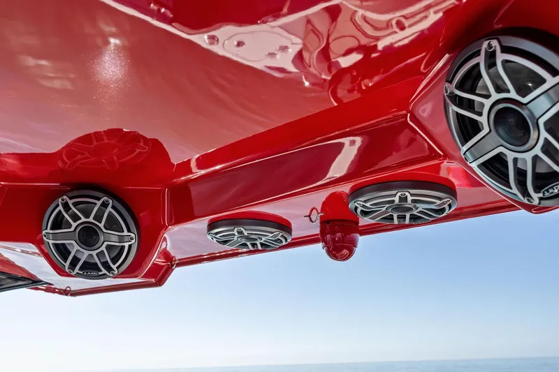  Yacht Photos Pics Red MTI V42 boat with sleek speakers, 2024 model, against a clear sky.