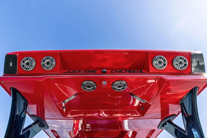  Yacht Photos Pics Red MTI V42 boat, 2024 model, with speakers and "Just in Time Chicago, IL" text.