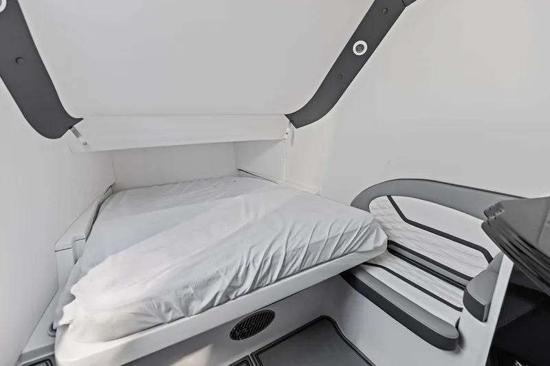 Yacht Photos Pics 2024 MTI V42 interior cabin with a compact bed and modern design.