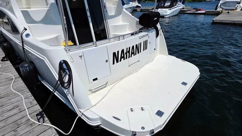  Yacht Photos Pics 2005 Carver 36 Mariner docked, rear view with "NAHANI III" name visible.