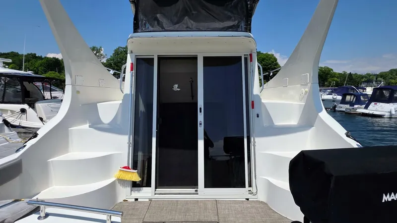  Yacht Photos Pics 2005 Carver 36 Mariner yacht with sleek design, docked at marina.