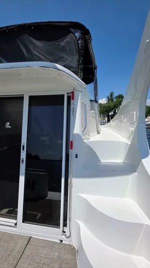  Yacht Photos Pics 2005 Carver 36 Mariner yacht with sleek white exterior and sliding glass doors.